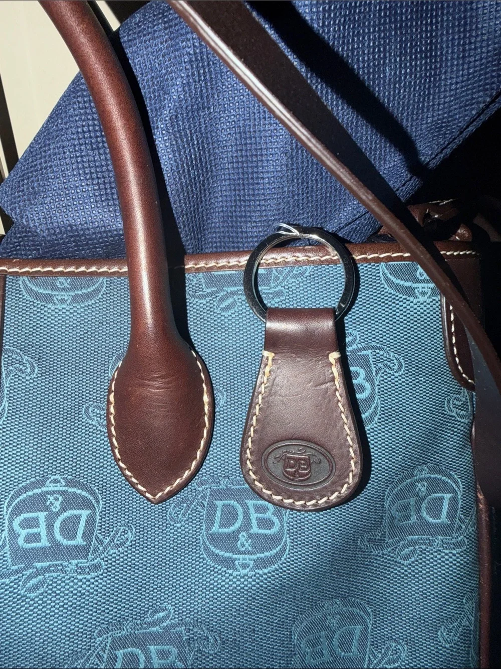 Dooney & Bourke Blue Canvas Duffel with Brown Leather Trim